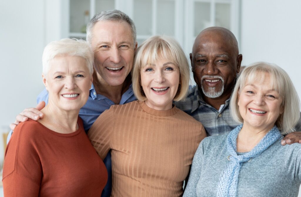 A group of senior friends pose for a photo
